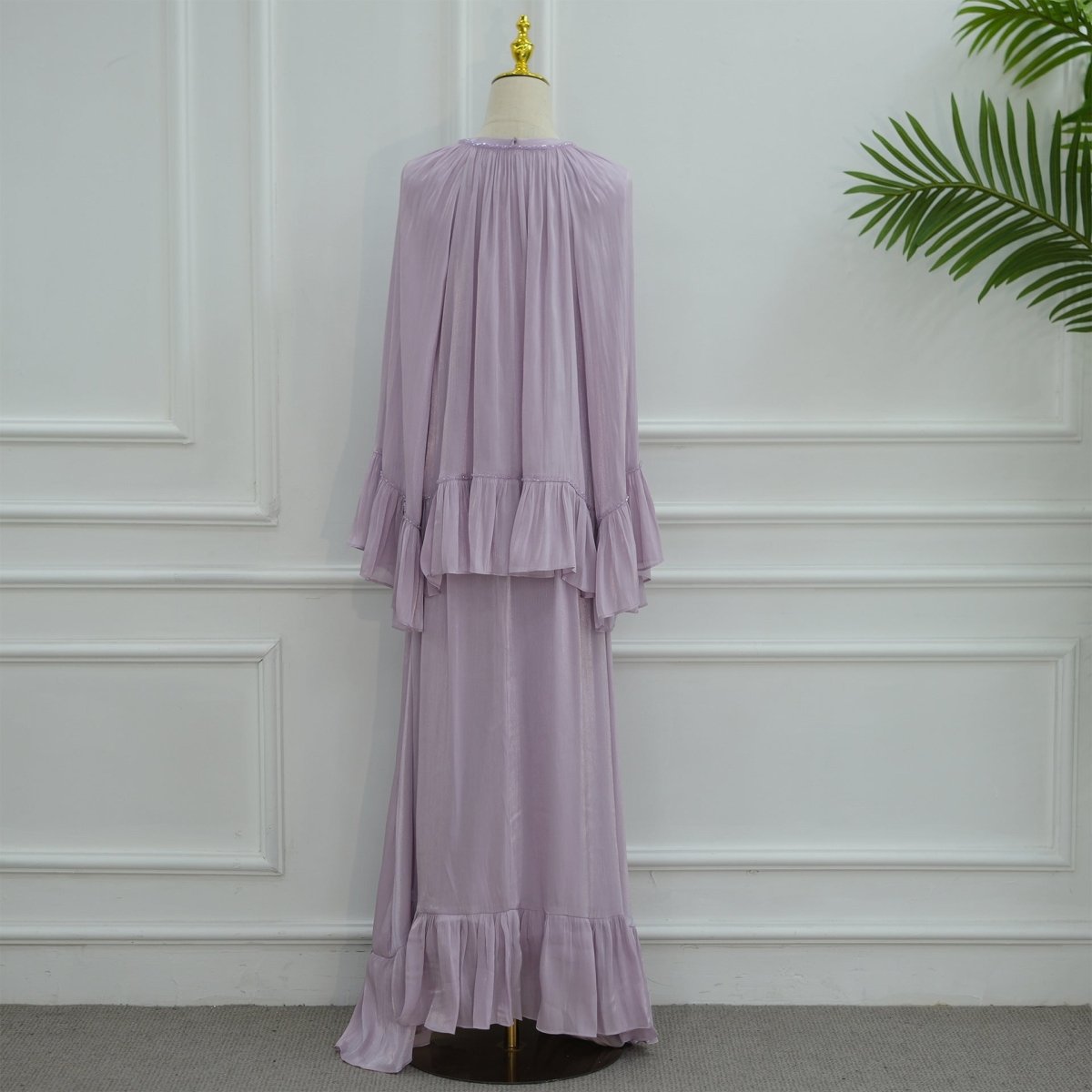 Editorial shot of crystal beaded ruffle abaya set styled for a formal occasion