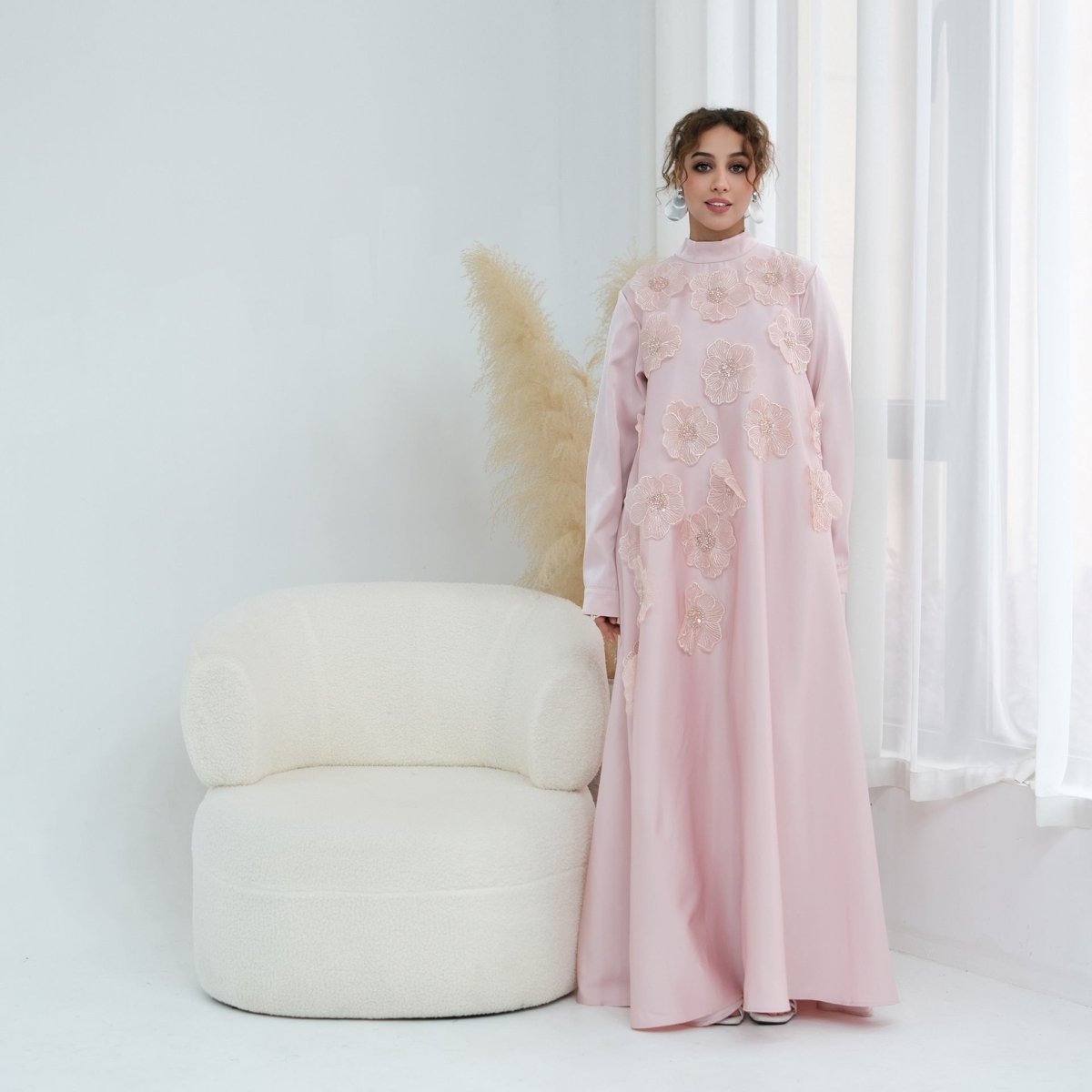 Full-length side profile of relaxed A-line silhouette in matte-finish fabric