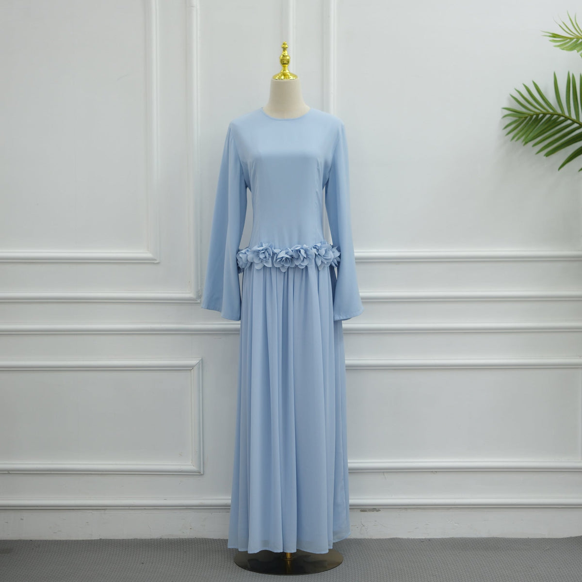 Trailing hem of pleated chiffon skirt on handcrafted rose maxi dress