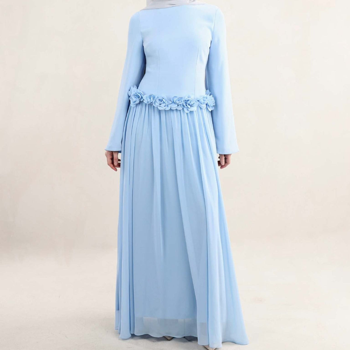 Wide bell sleeve opening at wrist on fitted floral maxi dress