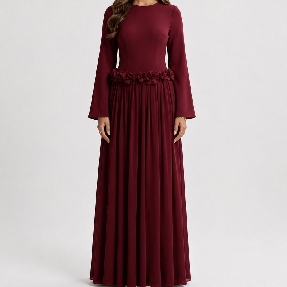 Side view of pleated chiffon skirt with fluid drape on floral maxi dress