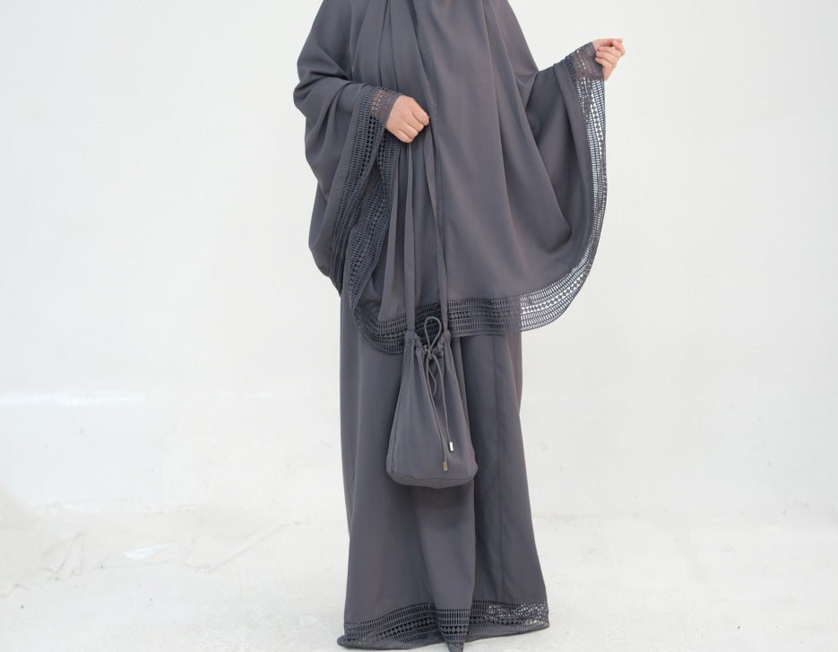 Close-up of geometric lace trim detail on nida prayer dress hem