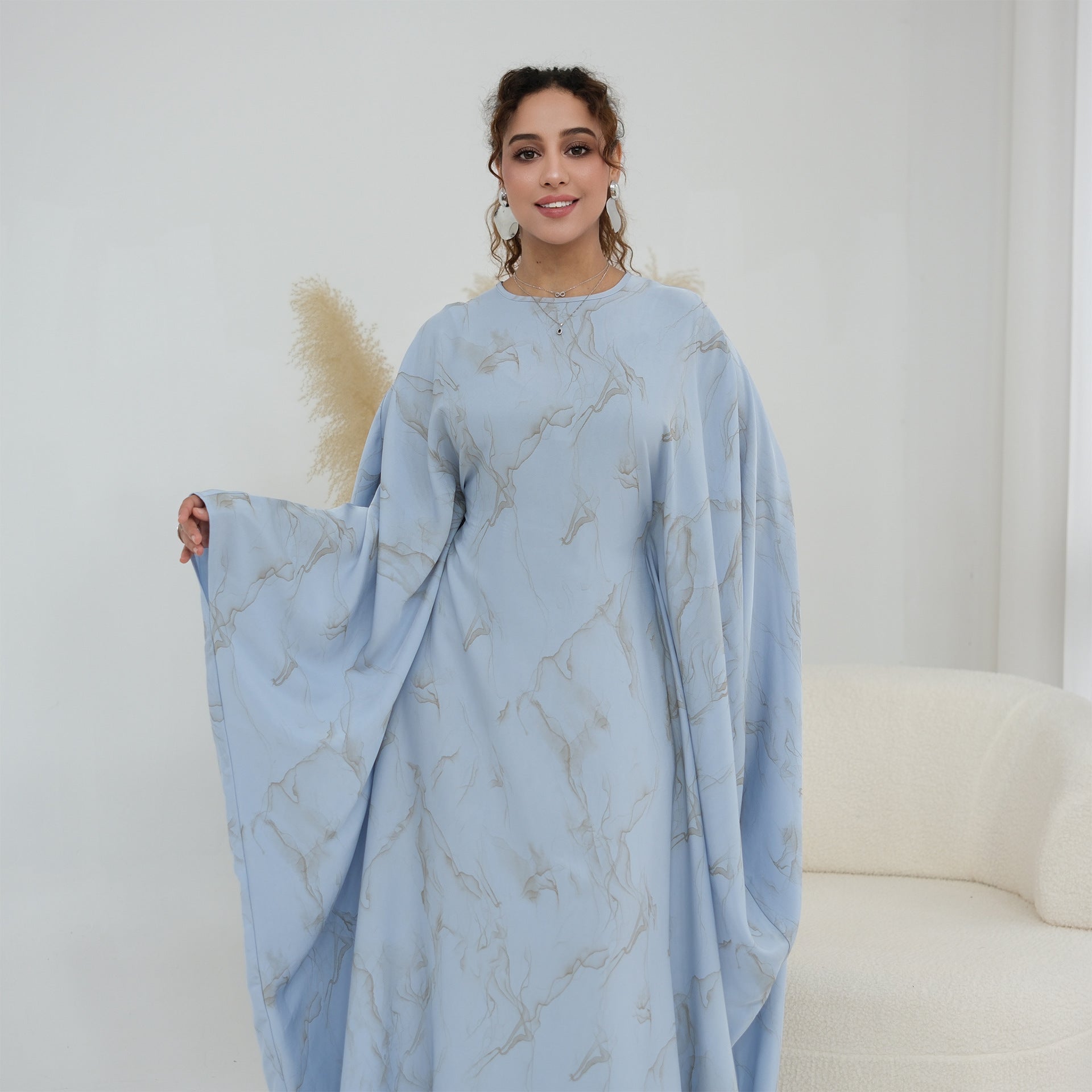 Close-up of round neckline and luminous fabric finish