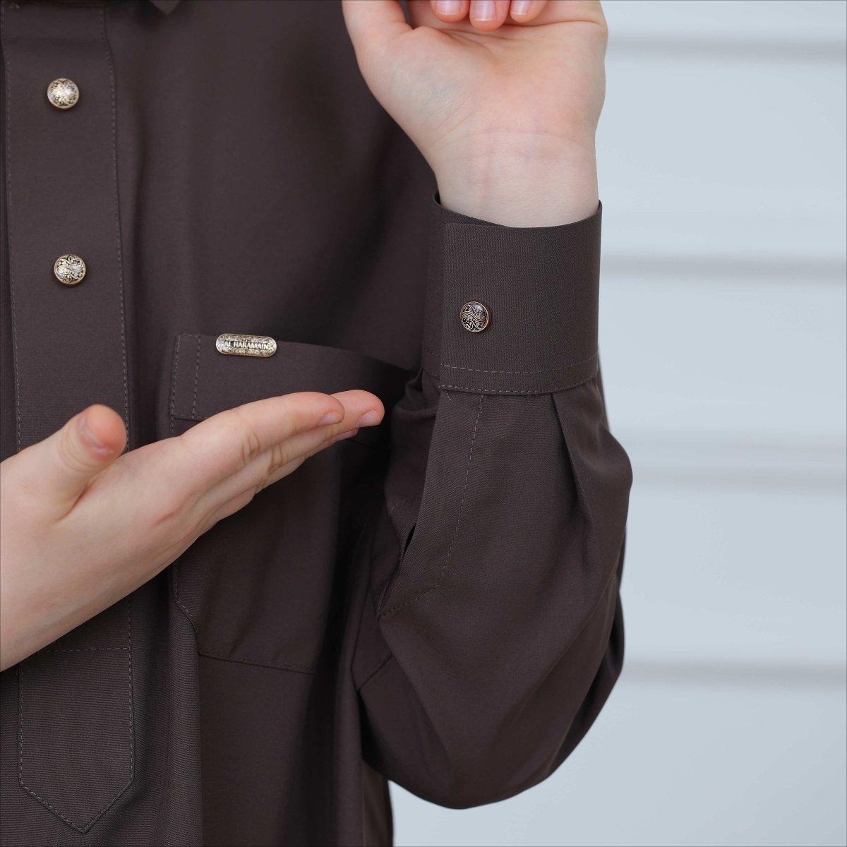 Button cuff detail on long-sleeve boys thobe in polyester blend