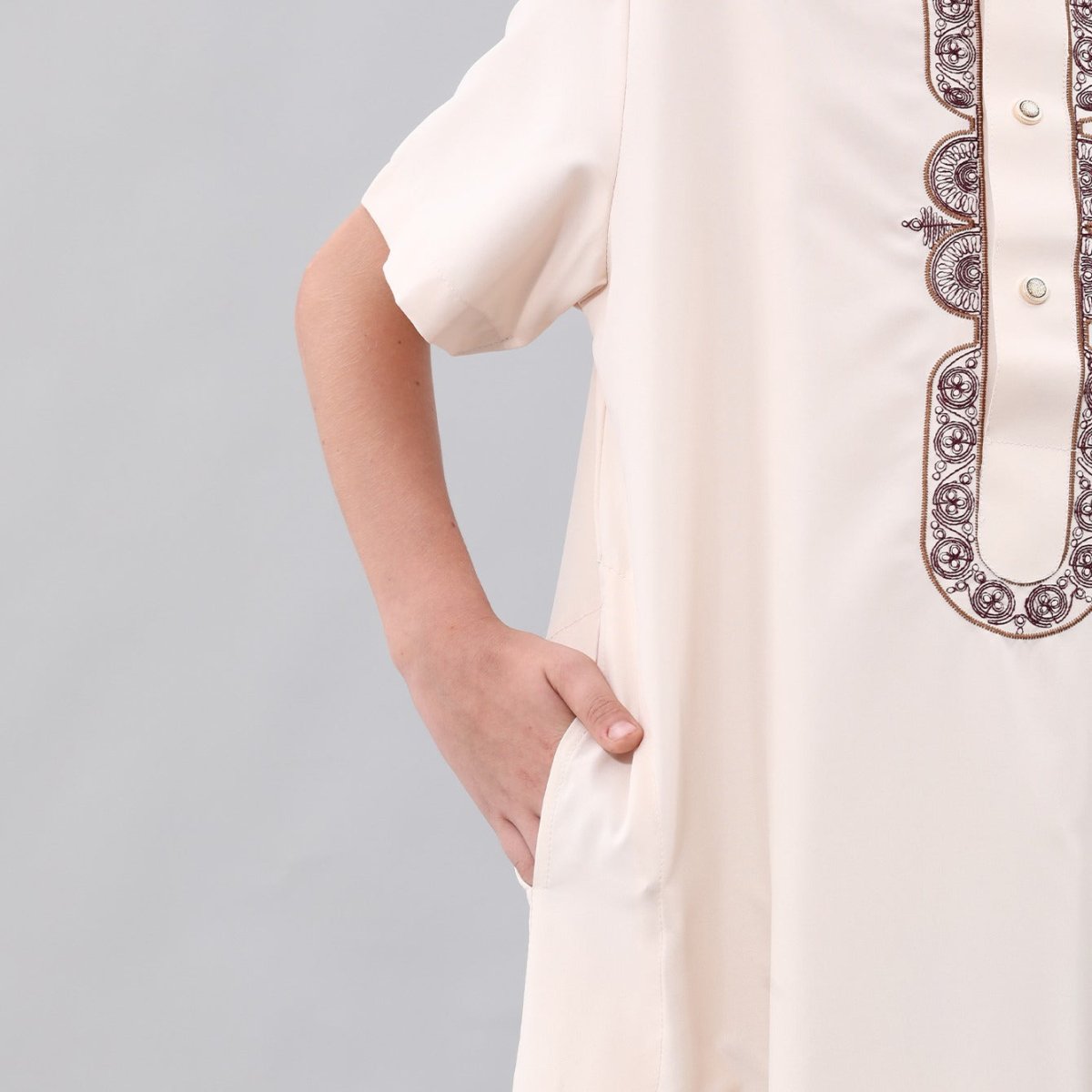 Full-length view of boys ankle-length embroidered Eid thobe