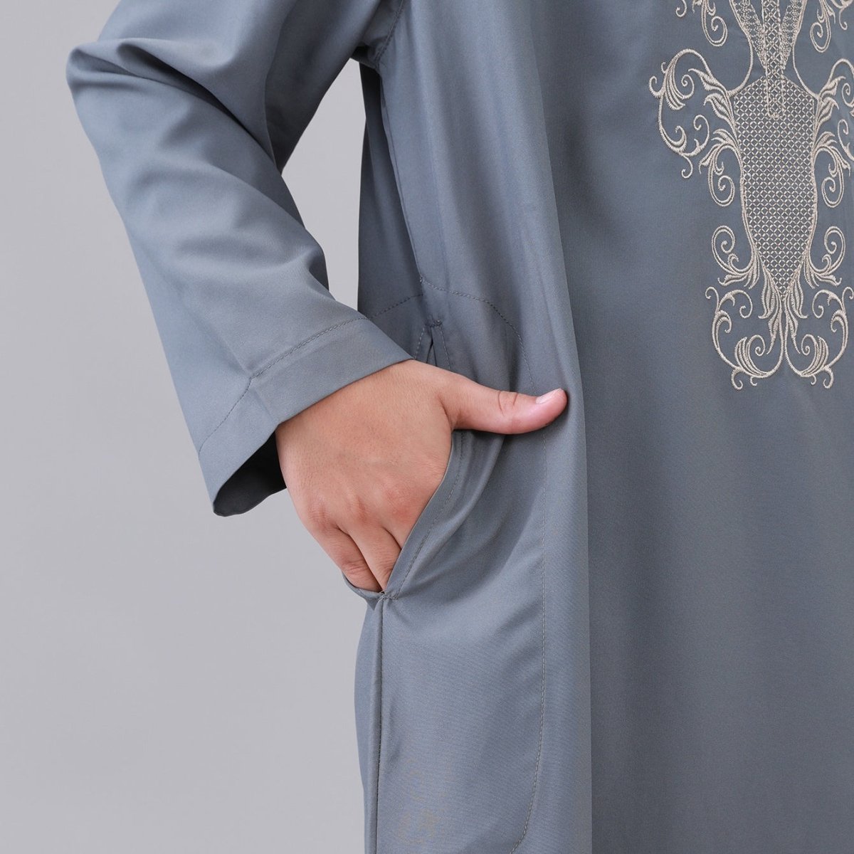 Boys' thobe with paisley embroidery pattern in white and black