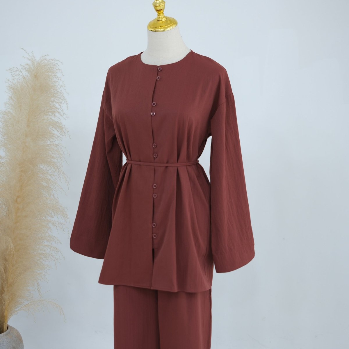 Structured matte fabric drape of modest wide-leg trouser set