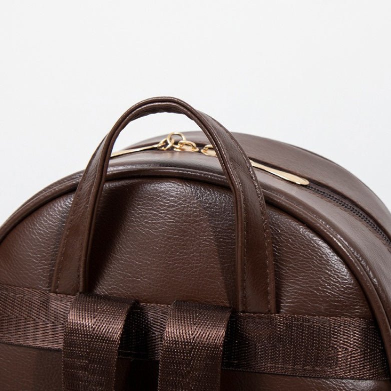 City backpack styled alongside modest everyday outerwear