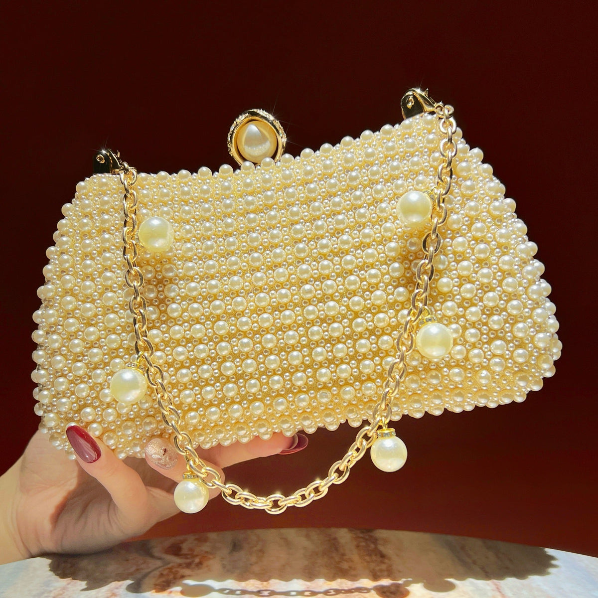 Close-up of high-grade ABS synthetic pearl beading on clutch surface