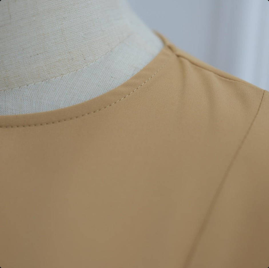 Dimensional contrast between smooth fabric and intricate floral lace panel