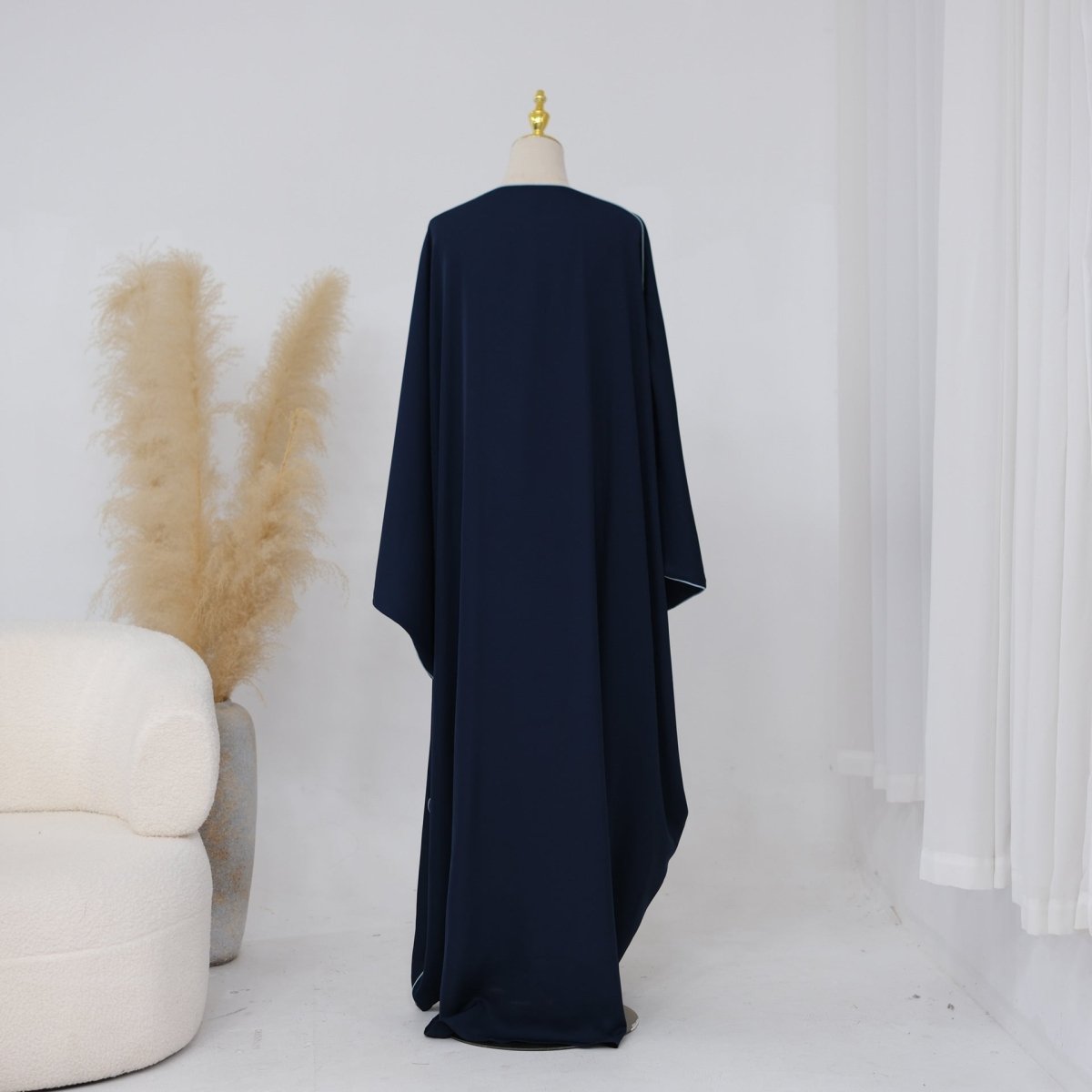 Front open V-neckline detail of the batwing abaya with no fastening