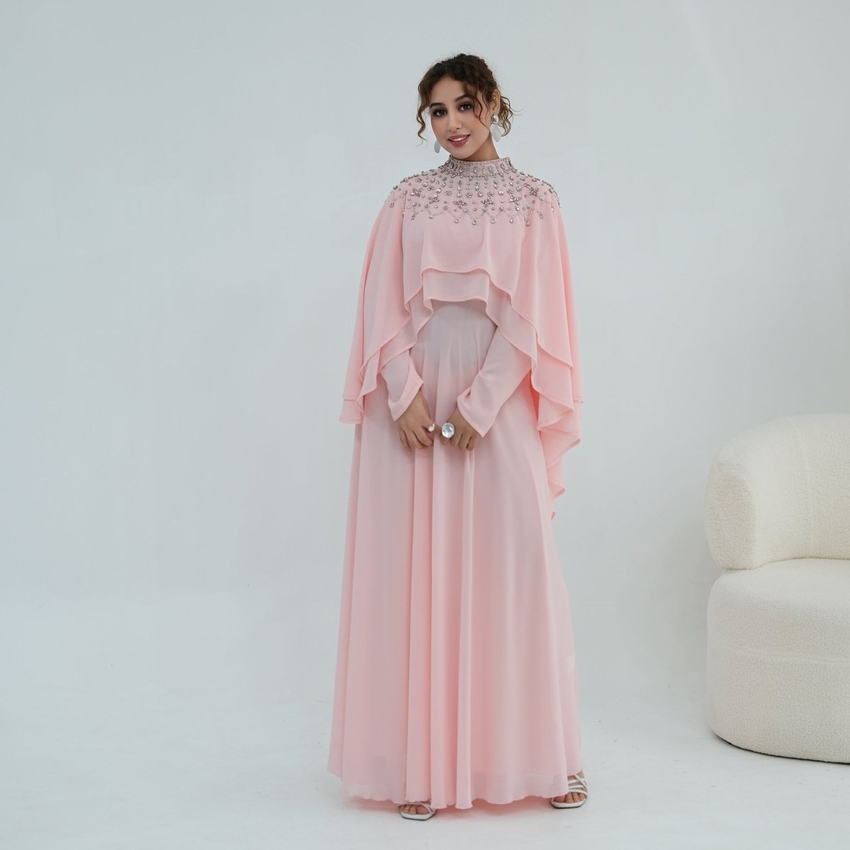 High stand collar detail with dense hand-set pearl embellishment