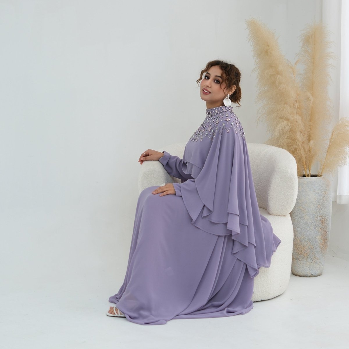 Back view showing self-tie waist cord gathered into bow on inner maxi dress