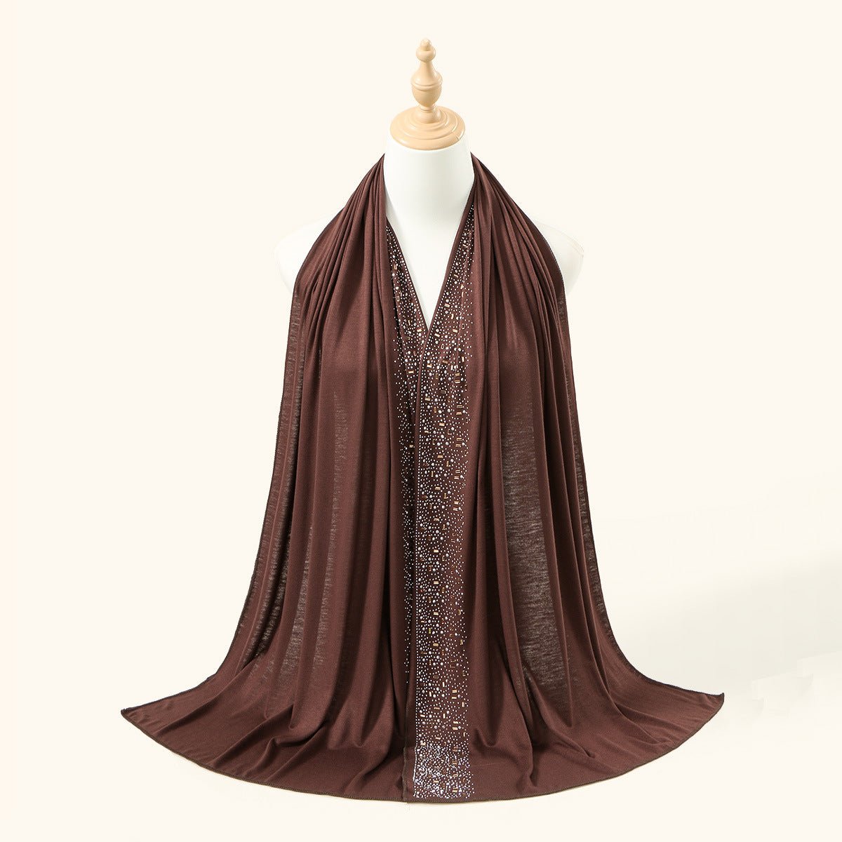 Champagne colourway of gold baguette embellished hijab worn framing the face