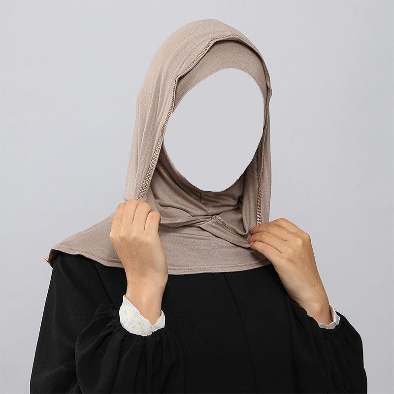 Close-up of gold rhinestone trim around the hijab face opening