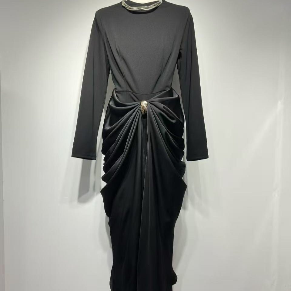 Side view showing cascading draped fabric panels and fitted pencil skirt silhouette