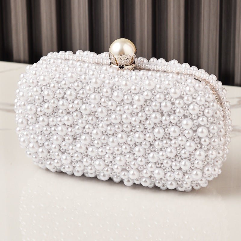 Side profile of hard-shell vintage beaded clutch purse with metal frame detail
