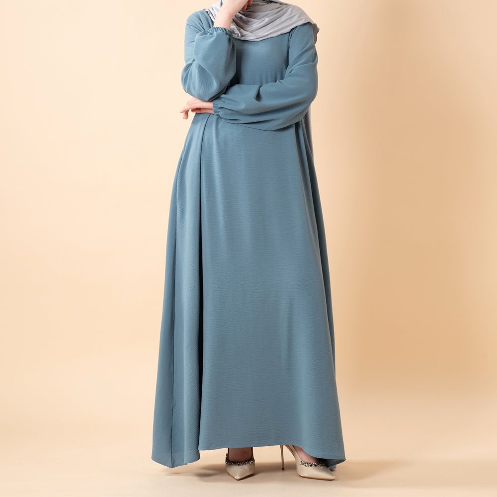 Forest olive crepe dress with hidden side pockets and modest coverage