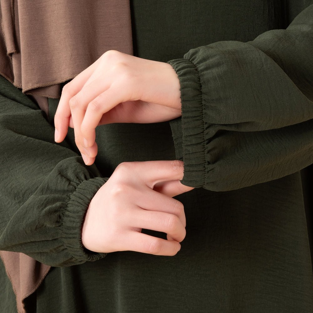 Forest olive everyday abaya with clean neckline and flowing hemline