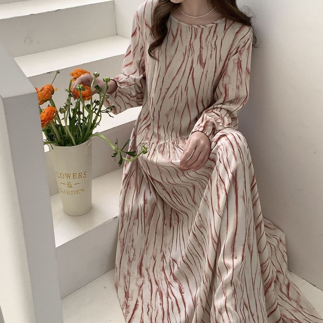 Floor-length hem detail of cotton silk floral maxi dress in motion
