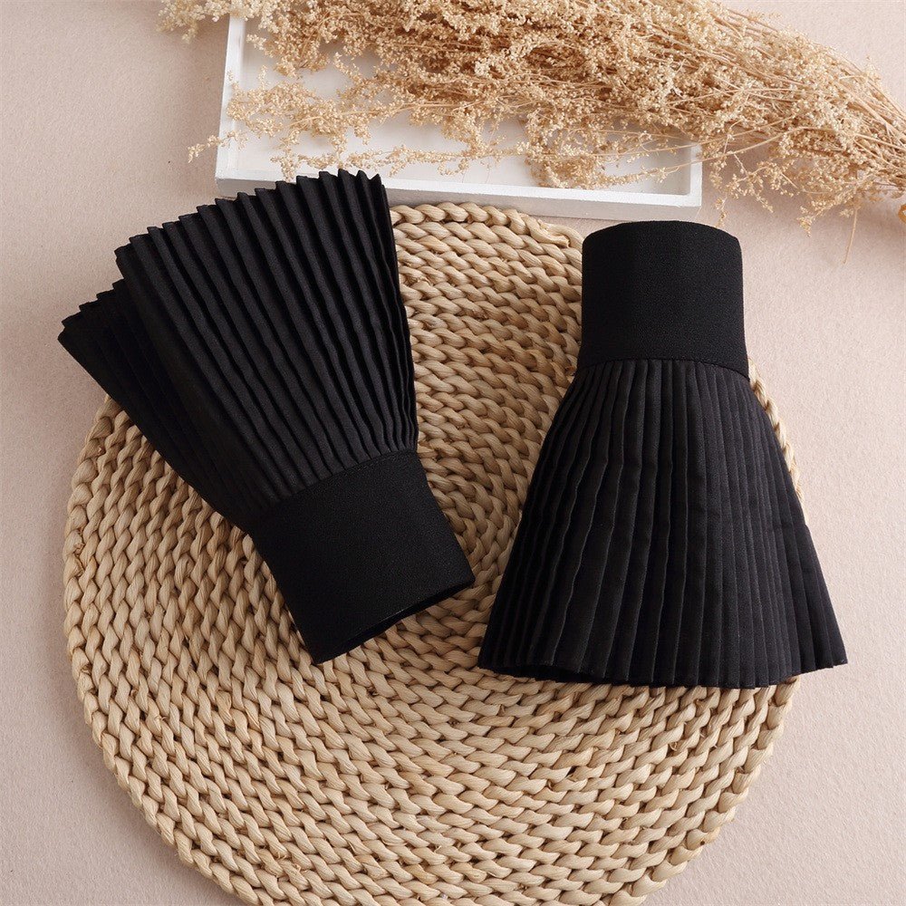 French pleated cuff sleeves in black with accordion pleat texture