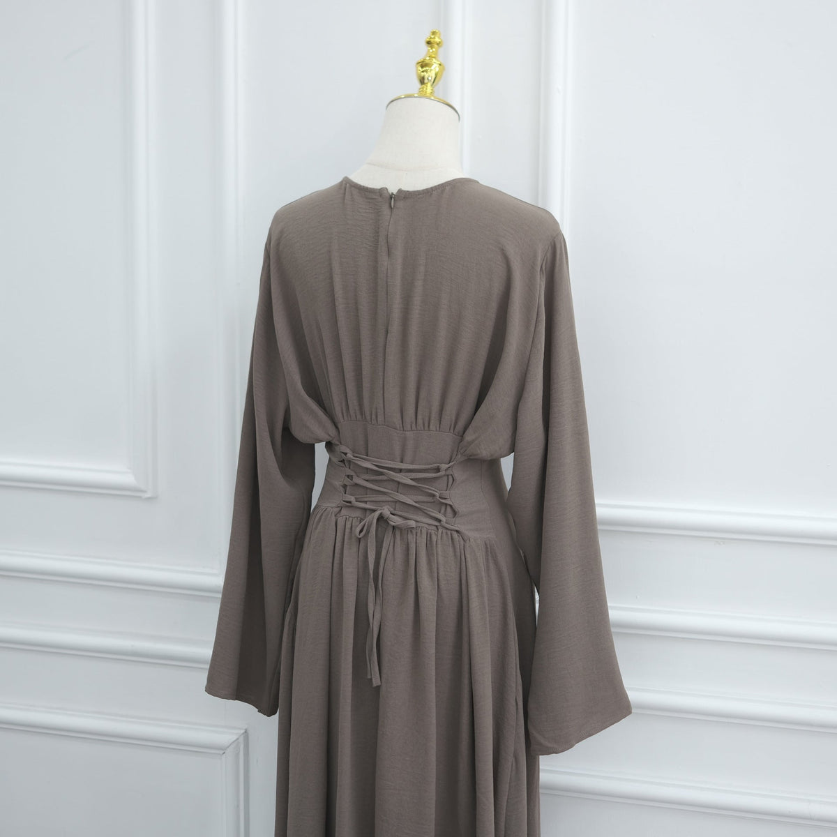 Three-quarter view of relaxed silhouette modest dress