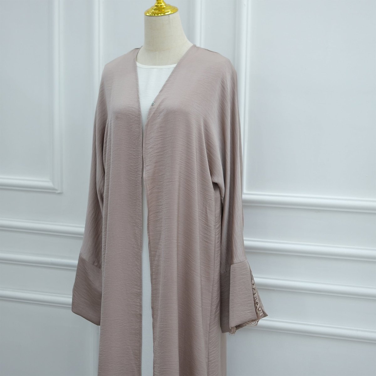 Model styling lace cuff abaya with hijab for modest daywear