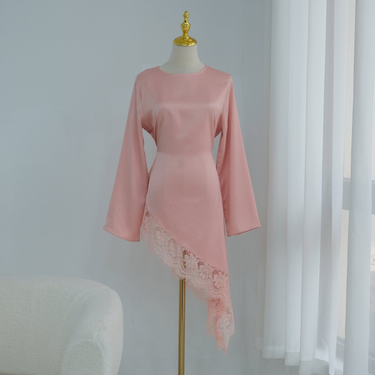 Close-up of back button closure and diagonal lace panel