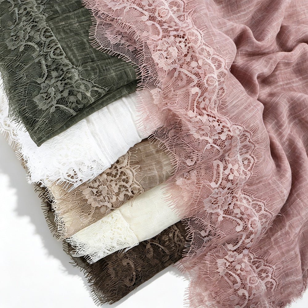 Close-up of delicate lace panel edging on solid colour hijab