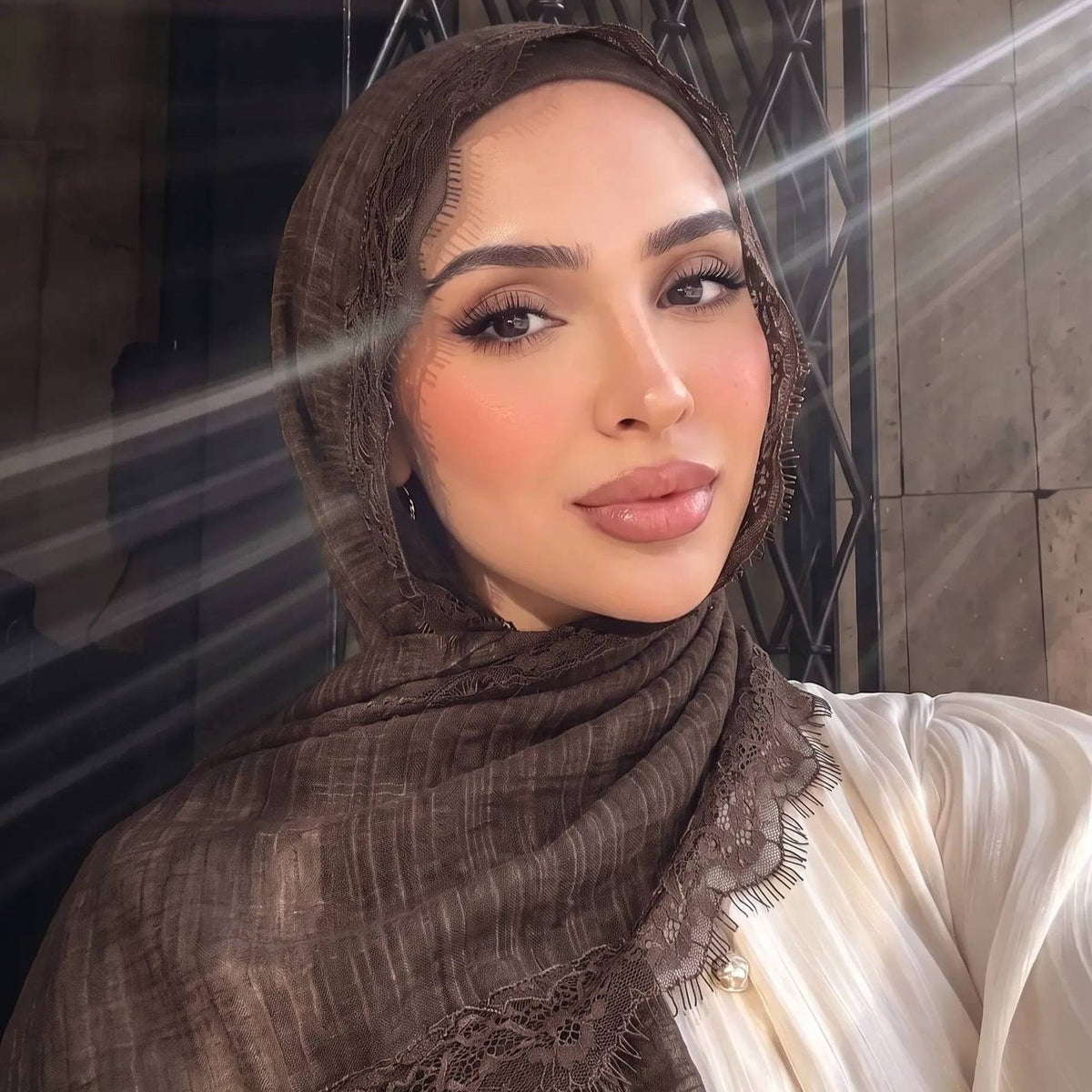 Lilac lace edge hijab styled loosely around the head