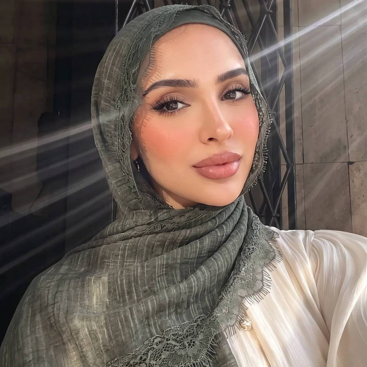 Mocha lace trim hijab worn with a modest abaya