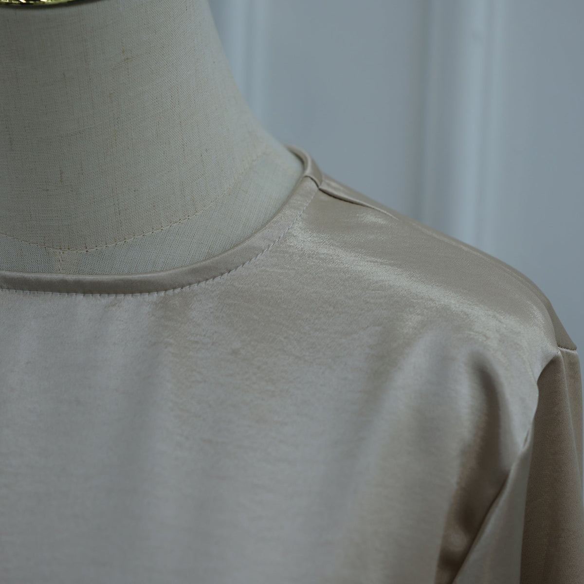 Round neckline with neat bound edge on satin co-ord top