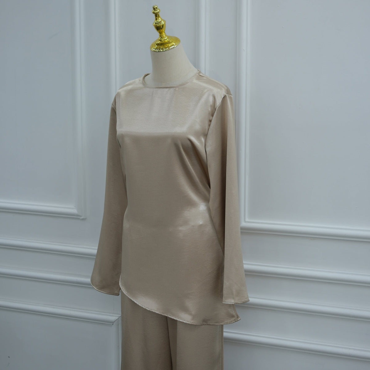 Wide-leg trousers falling in fluid floor-length drape
