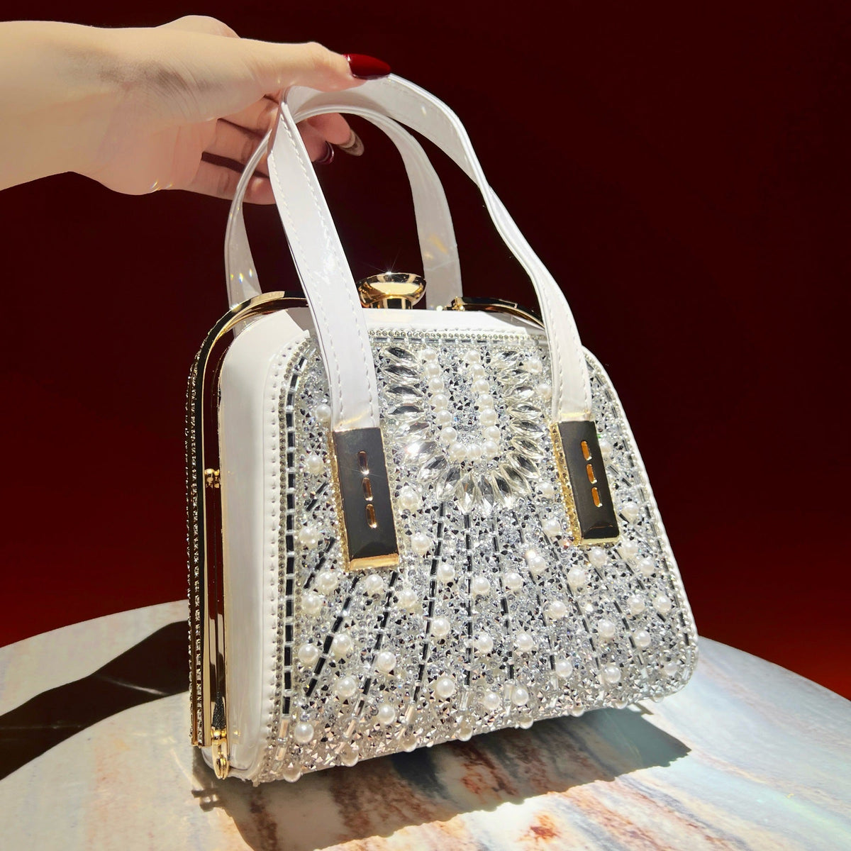 360-degree crystal shine detail on structured box evening clutch bag