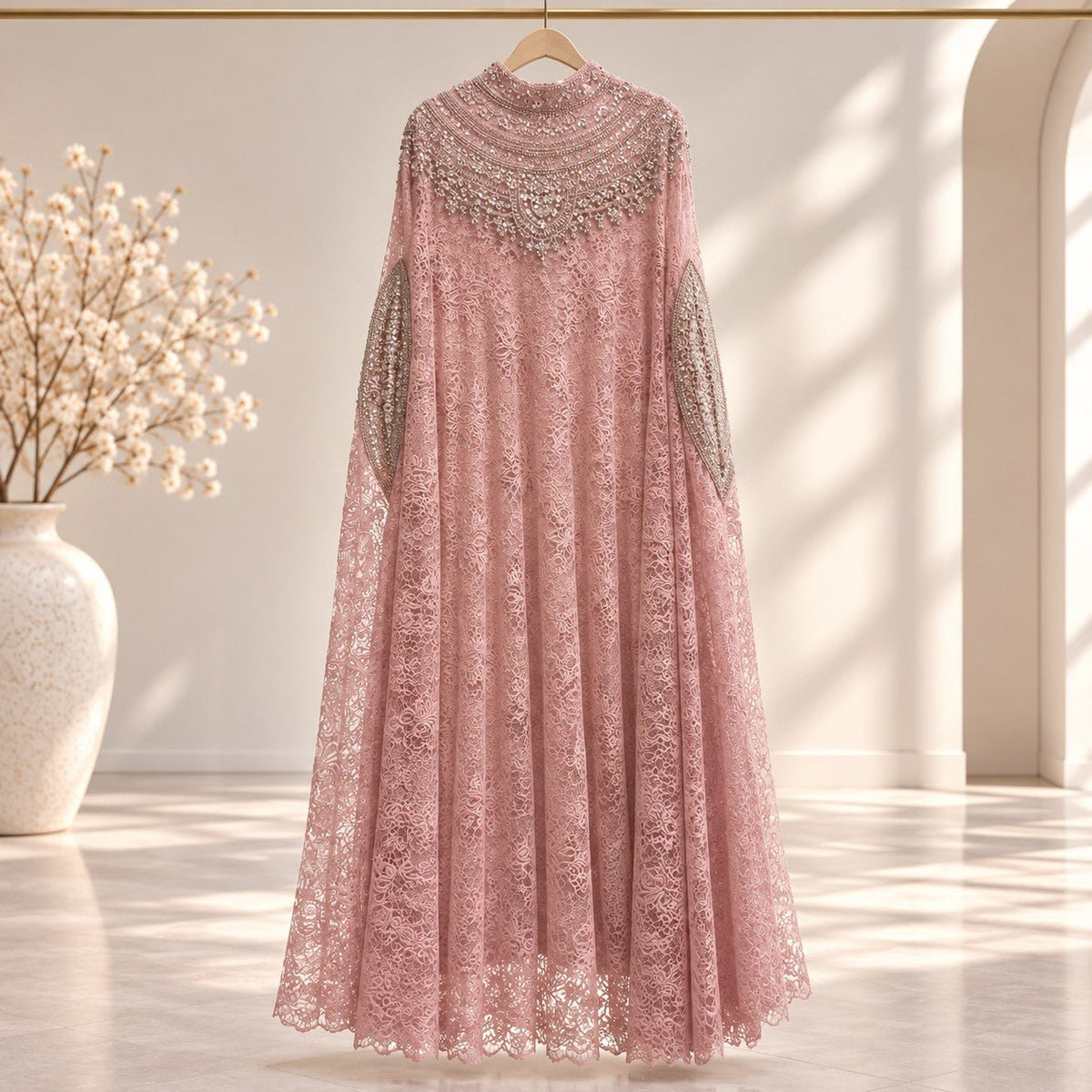 Close-up of textured openwork crochet lace outer layer on modest top set