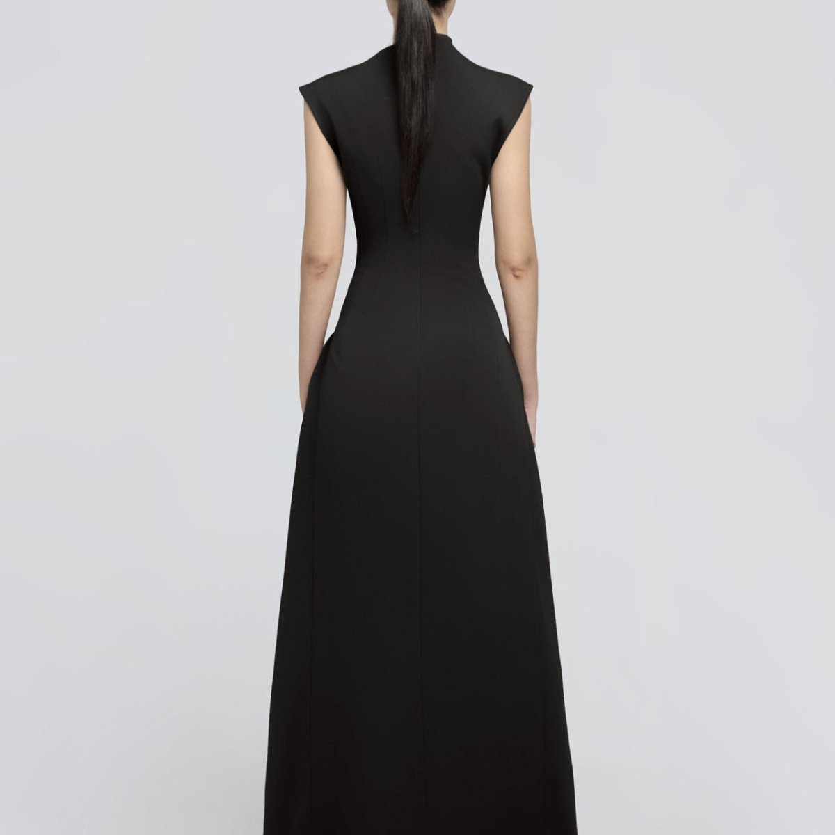 Asymmetric modest gown with sophisticated fitted silhouette