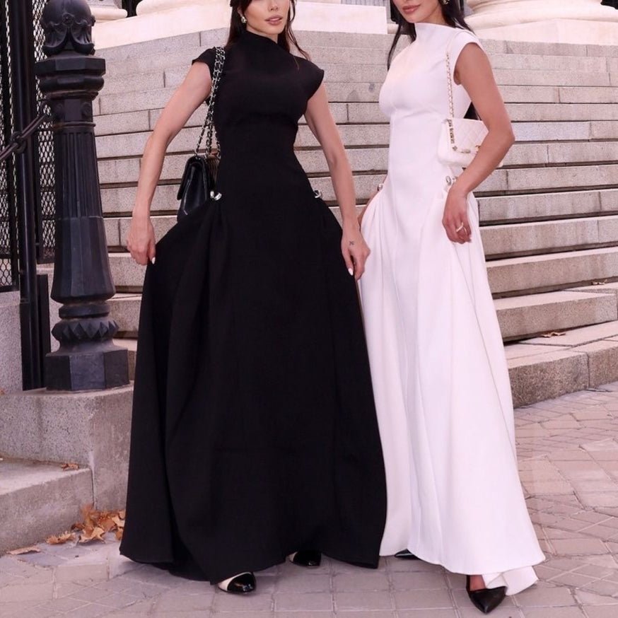 Black fitted maxi dress with minimalist design and architectural detail