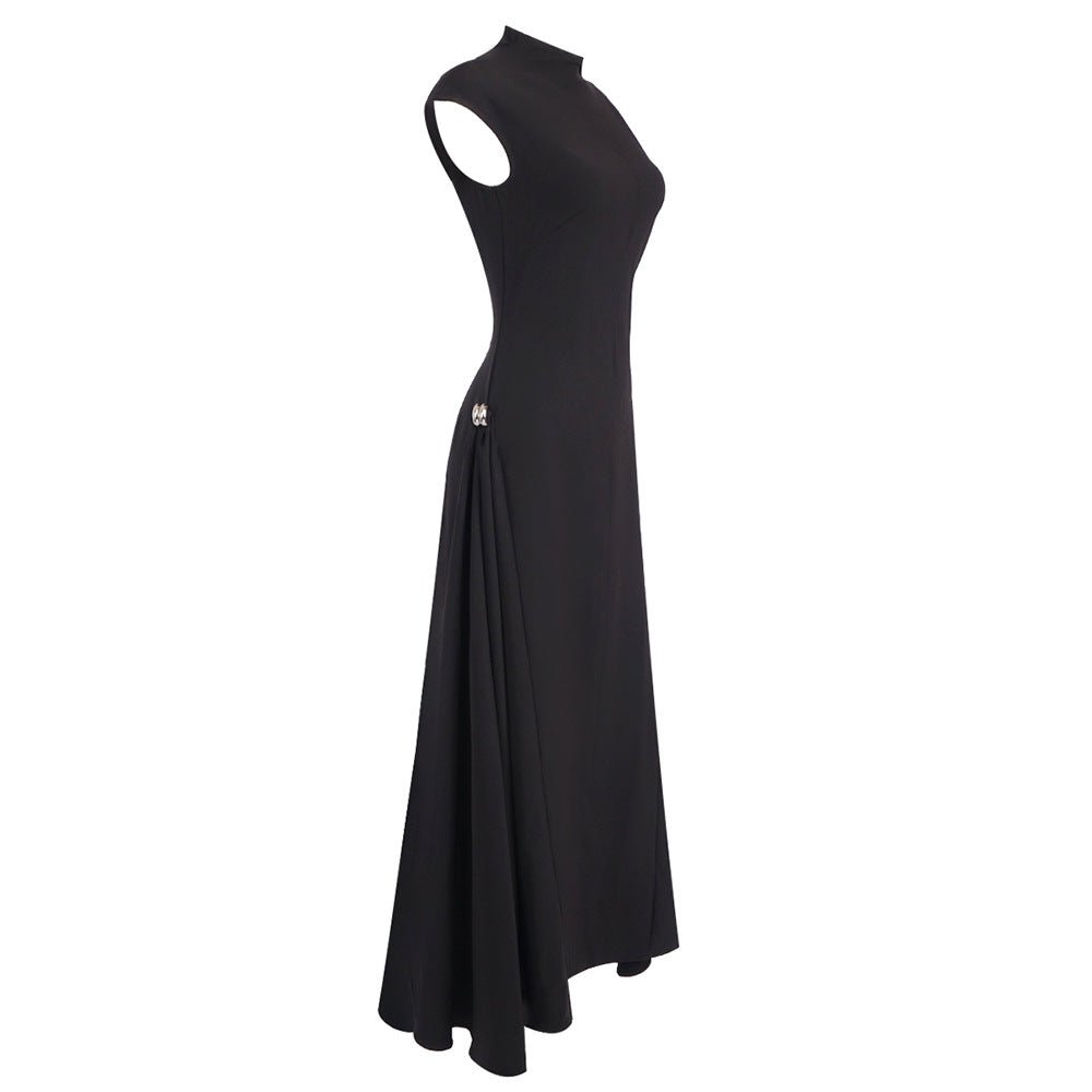 Black architectural maxi dress with fitted construction and clean finish