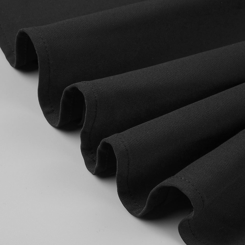 Minimalist black gown with asymmetric detail and sophisticated drape