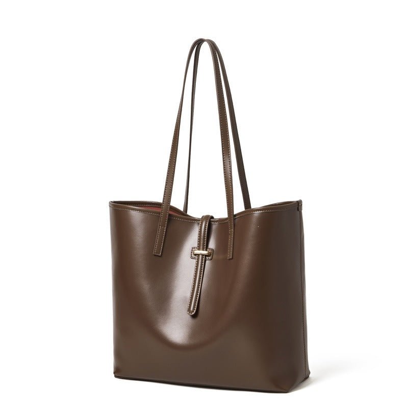 Close-up of top zip closure and structured base of minimalist work tote bag