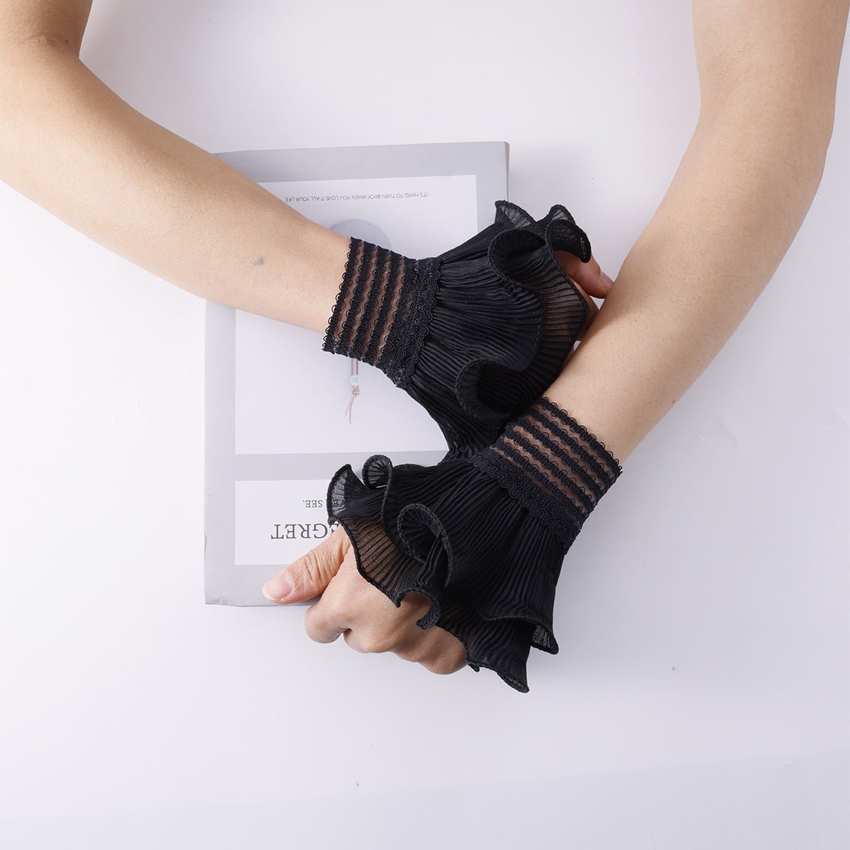 Pearl embellished wrist cuffs with layered pleated ruffle design