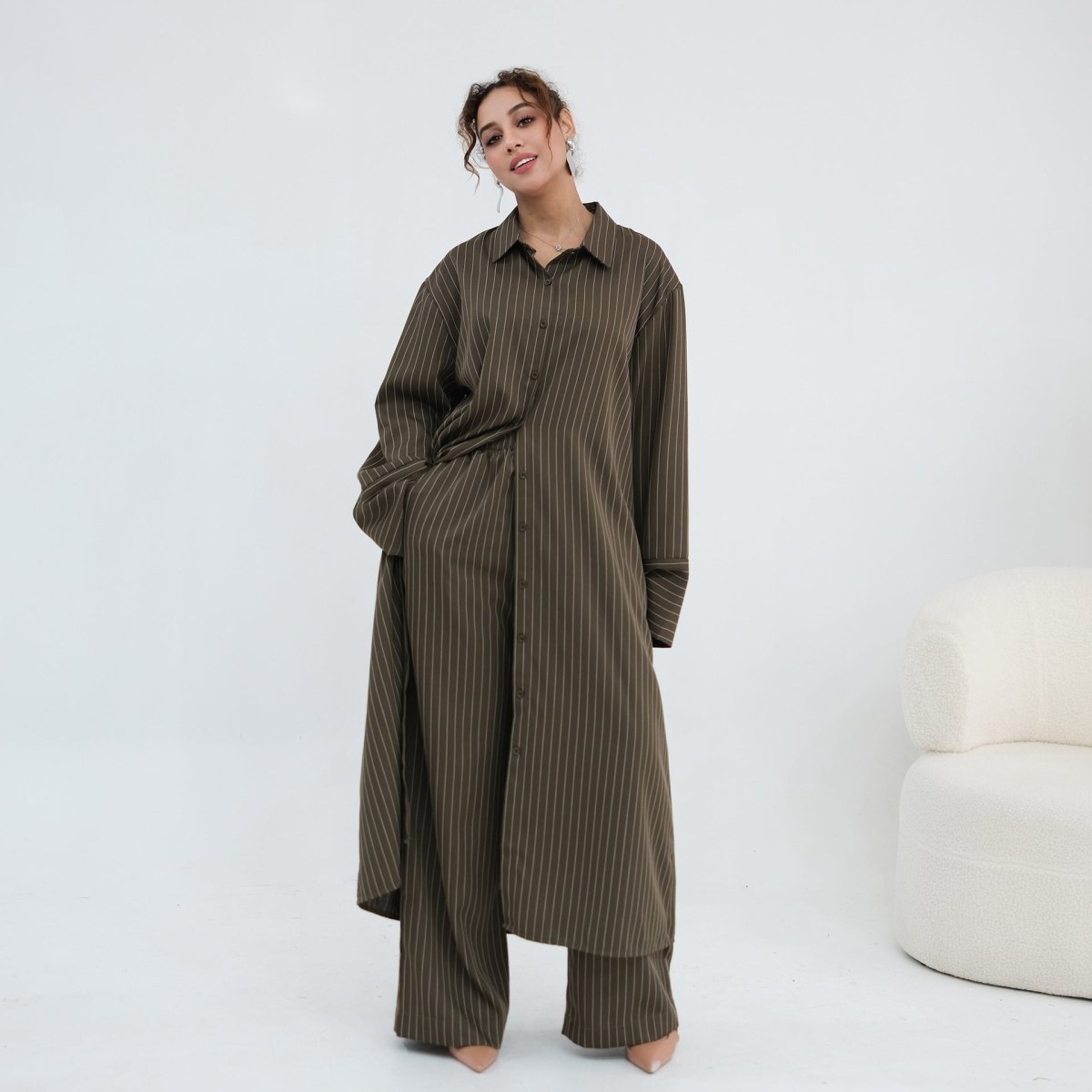 Wide cuff detail on the oversized pinstripe shirt sleeve