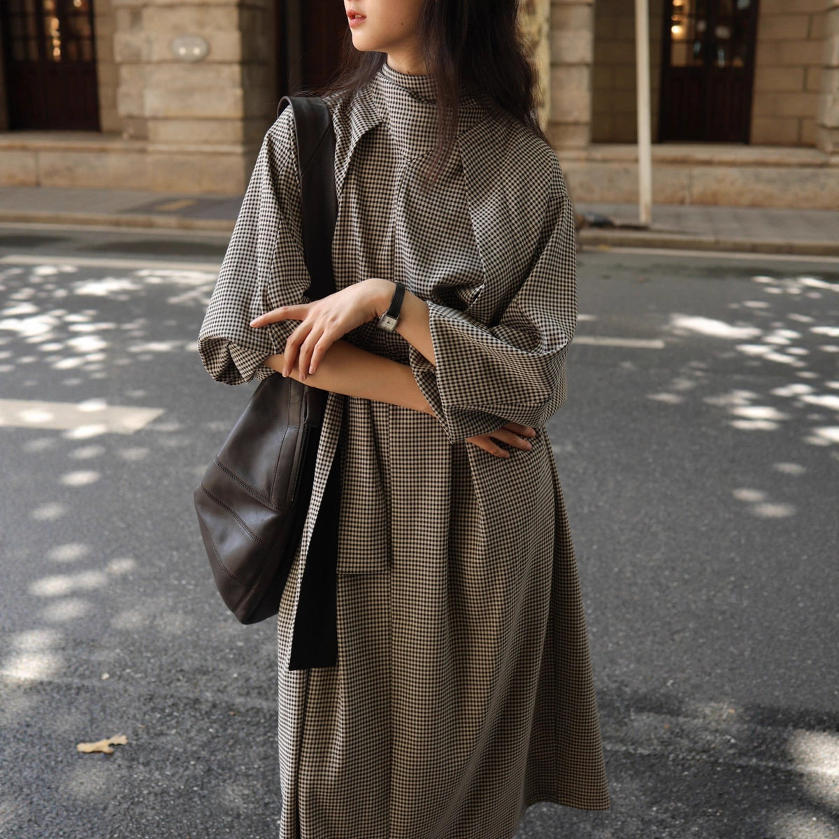 Side view of long-sleeve trench maxi dress styling