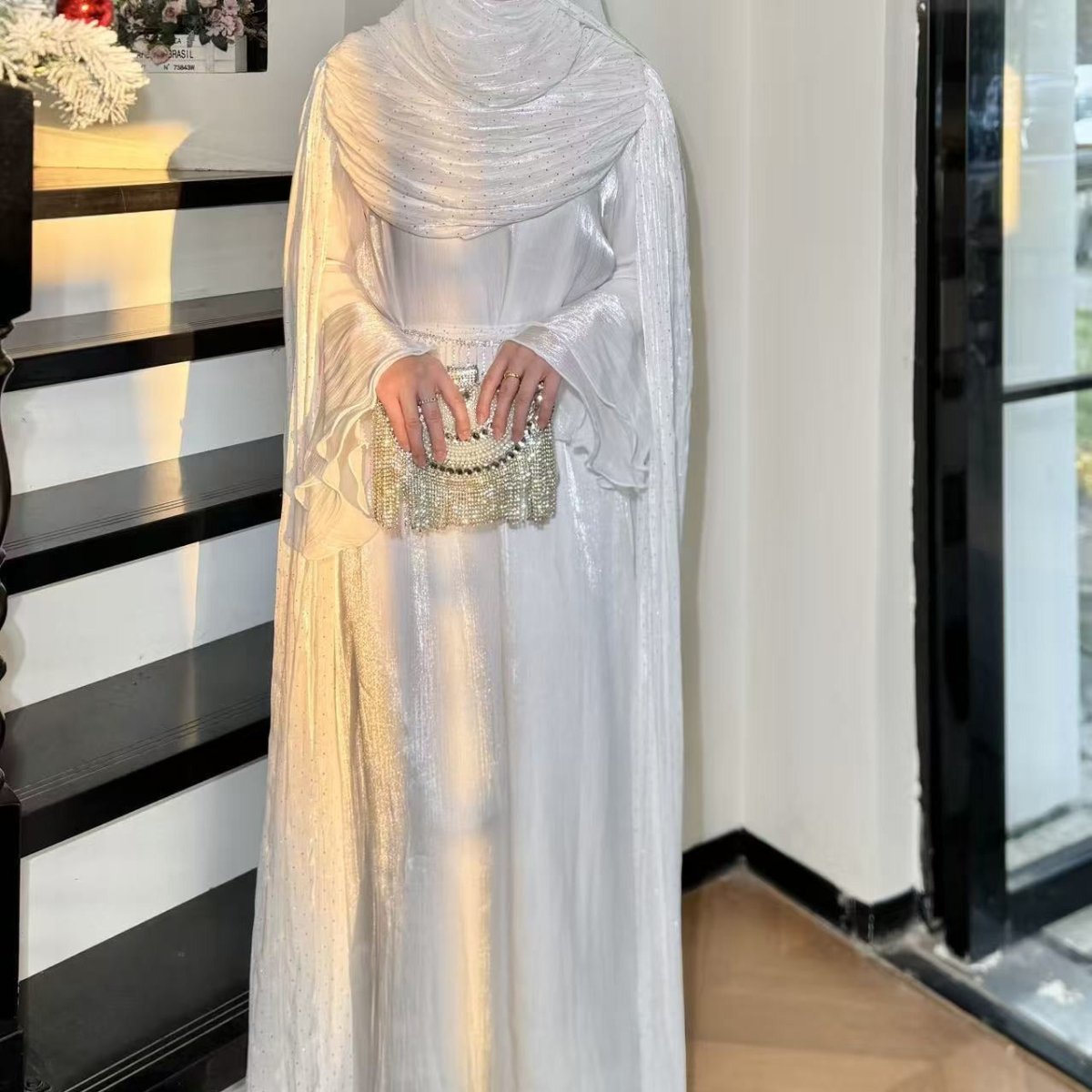 Texture detail of dimensional pleating on silk abaya fabric