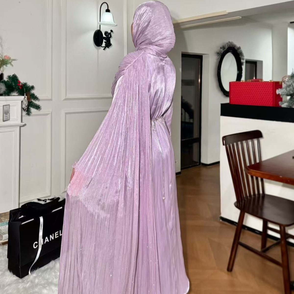Close-up of pleated hem detail on cape sleeve maxi abaya