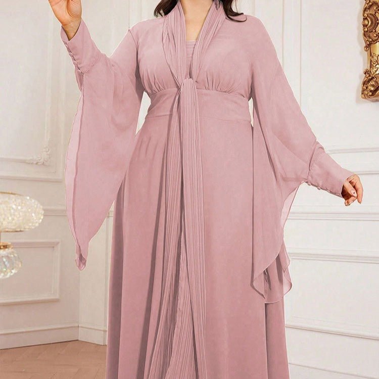 Close-up of vertical pleated panel and long scarf tie neckline detail