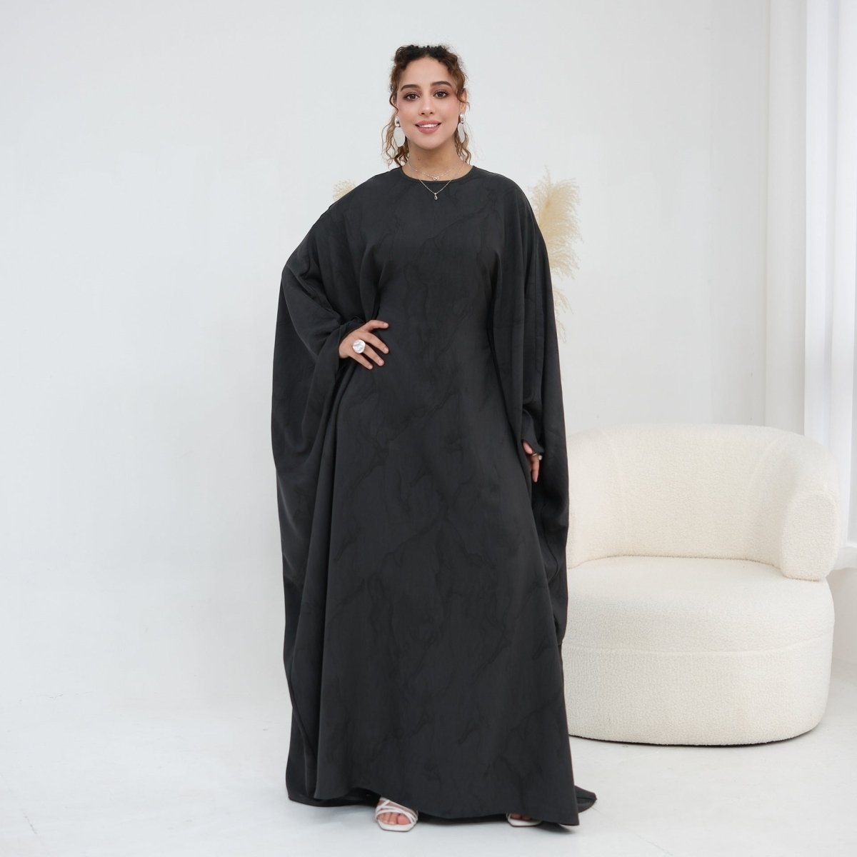 Overhead drape of batwing sleeve showing full wing silhouette