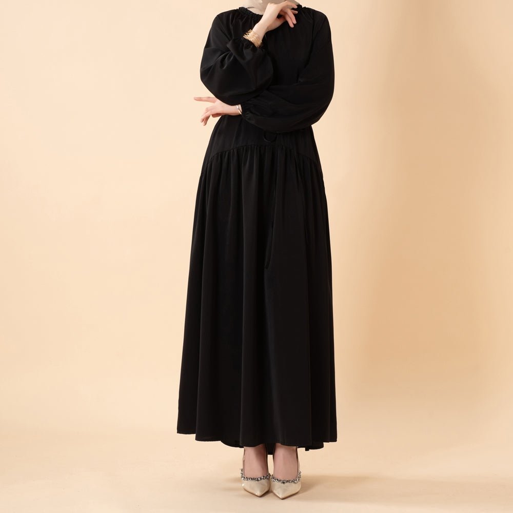 Full outfit view of relaxed pleated abaya suitable for work and casual occasions