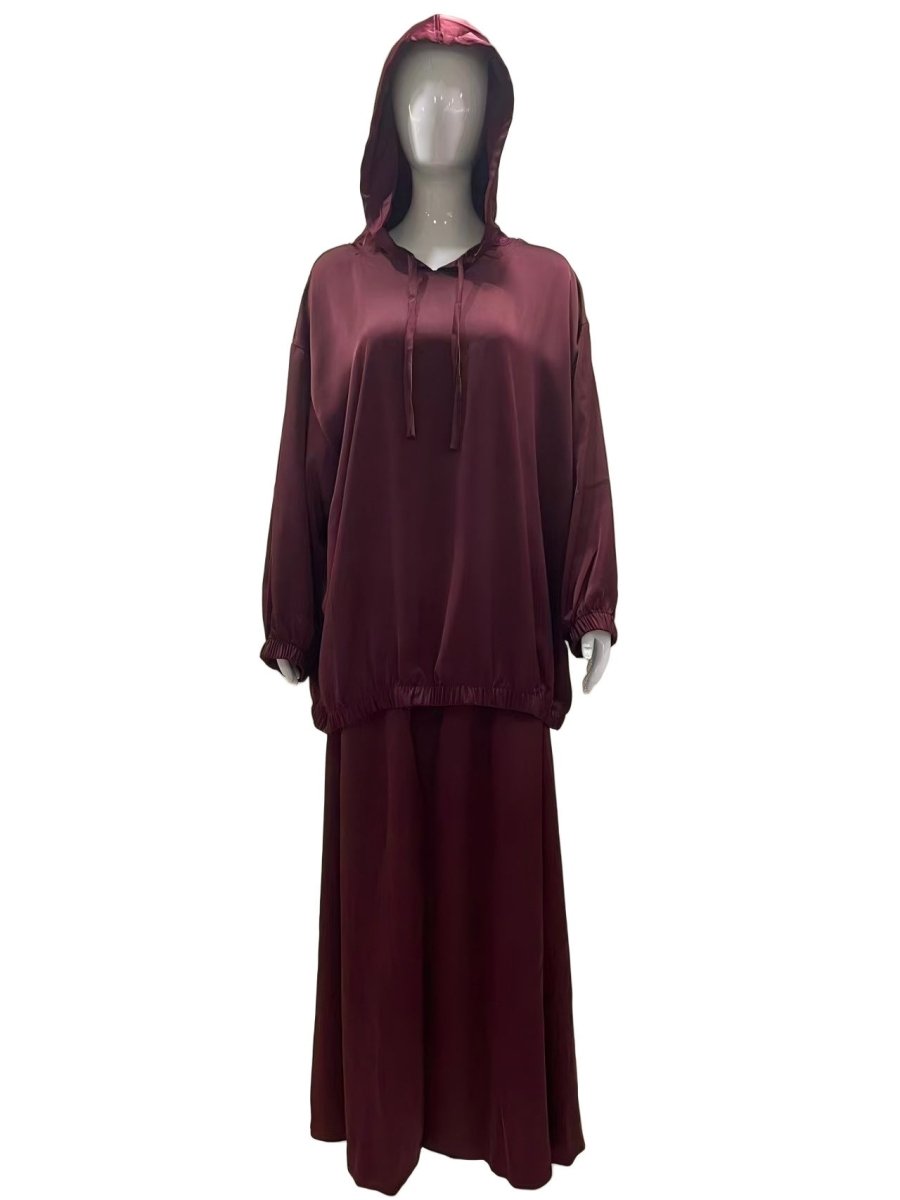 Satin hooded top and maxi skirt set laid flat showing complete 2-piece ensemble