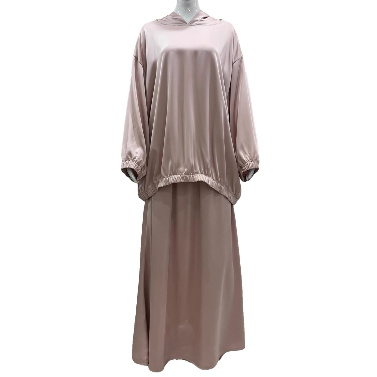 Detail shot of elasticated cuffs and gathered hem on satin hooded top